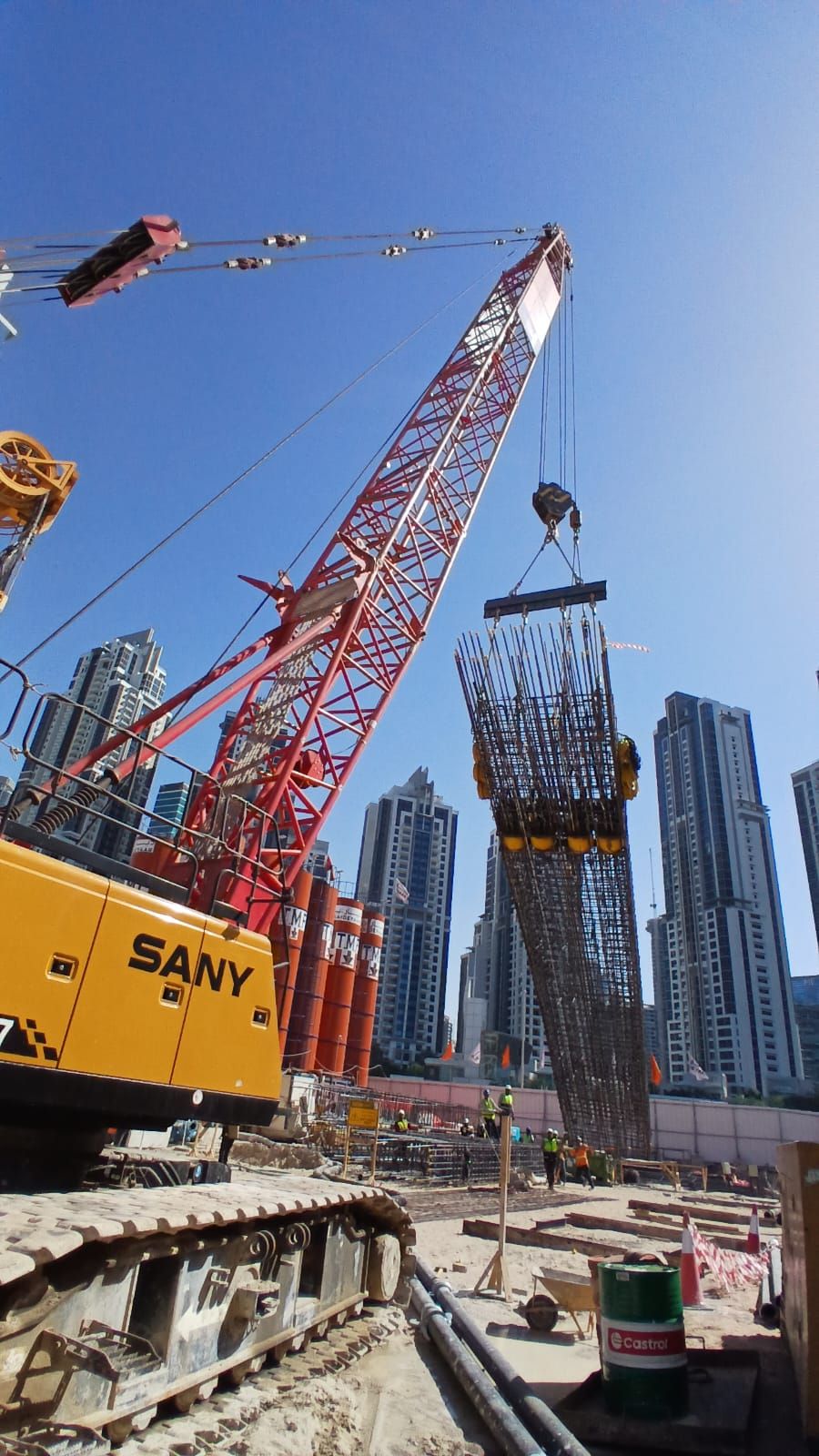 TMF crew lifting a diaphragm-wall cage at DWTN Residences