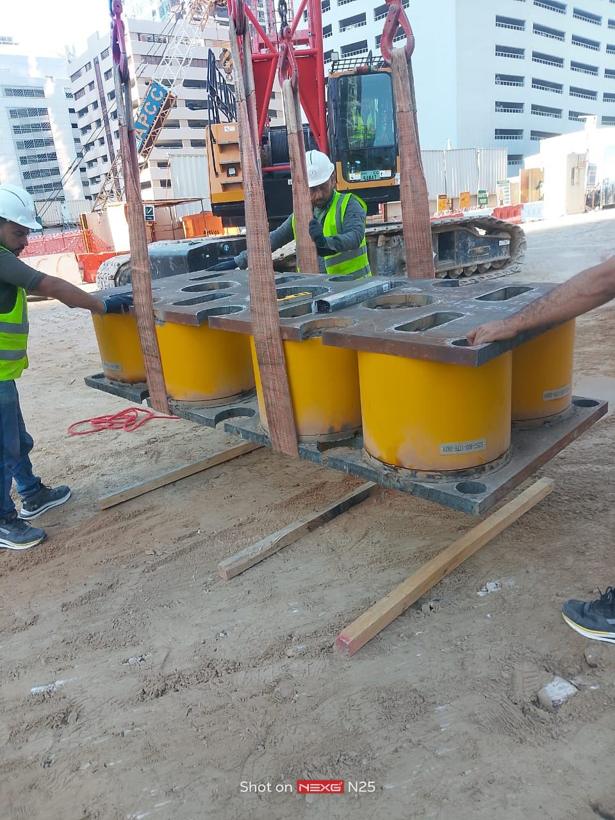 TMF crew setting hydraulic jacks for a static pile load test